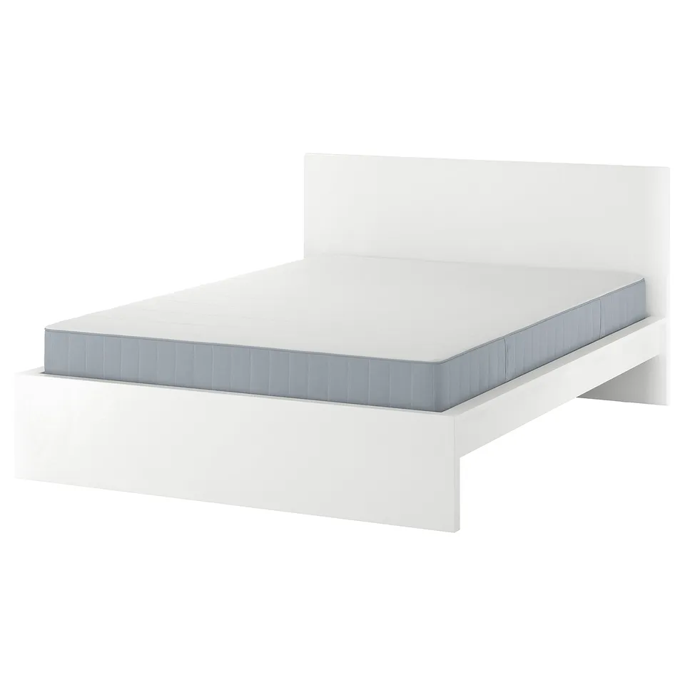 White MALM bed with greyish mattress, modern minimalist design.