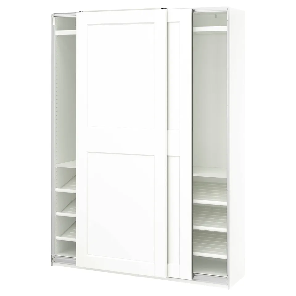 White PAX wardrobe with sliding doors showcasing internal shelves.