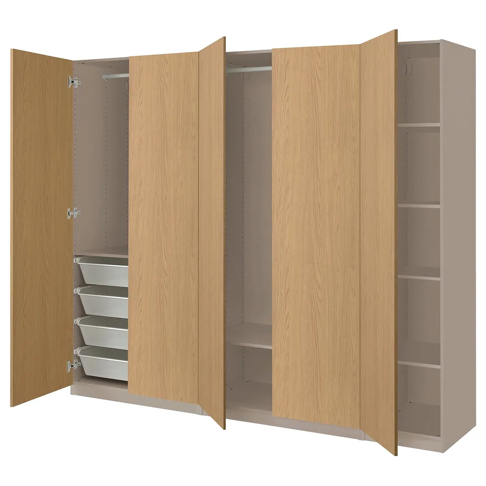 An open light brown PAX wardrobe with shelves and drawers.