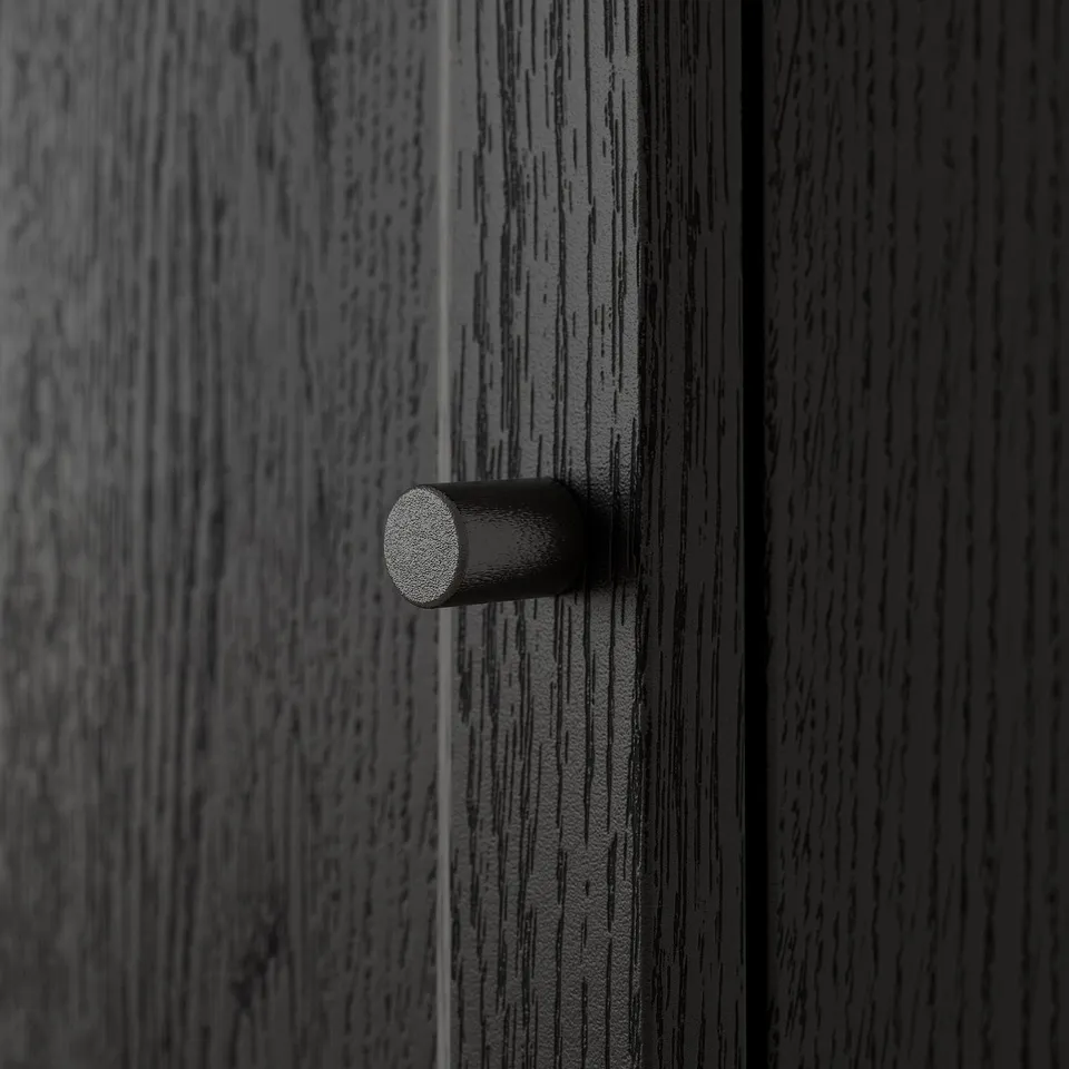 Black door handle with textured grip.