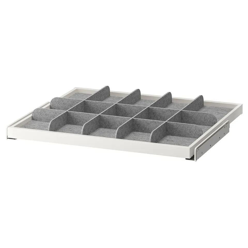 A KOMPLEMENT pull-out tray with multiple compartments. White fibreboard, grey divider, perfect for organising scarves and ties.