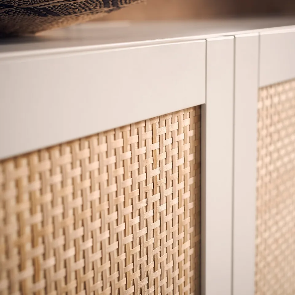 The BESTÅ tv bench woven light wood panel design with adjustable shelves and cable management system.