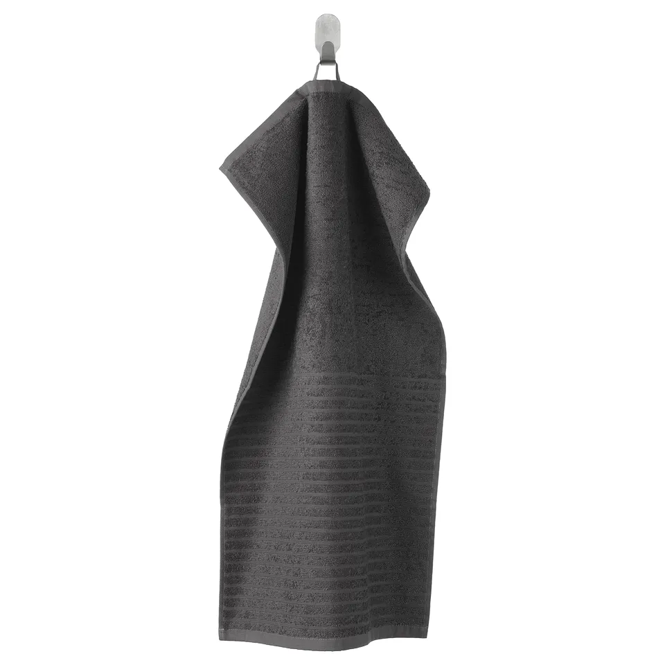 Image displays a hanging dark grey VÅGSJÖN towel with striped textured design in soft cotton.