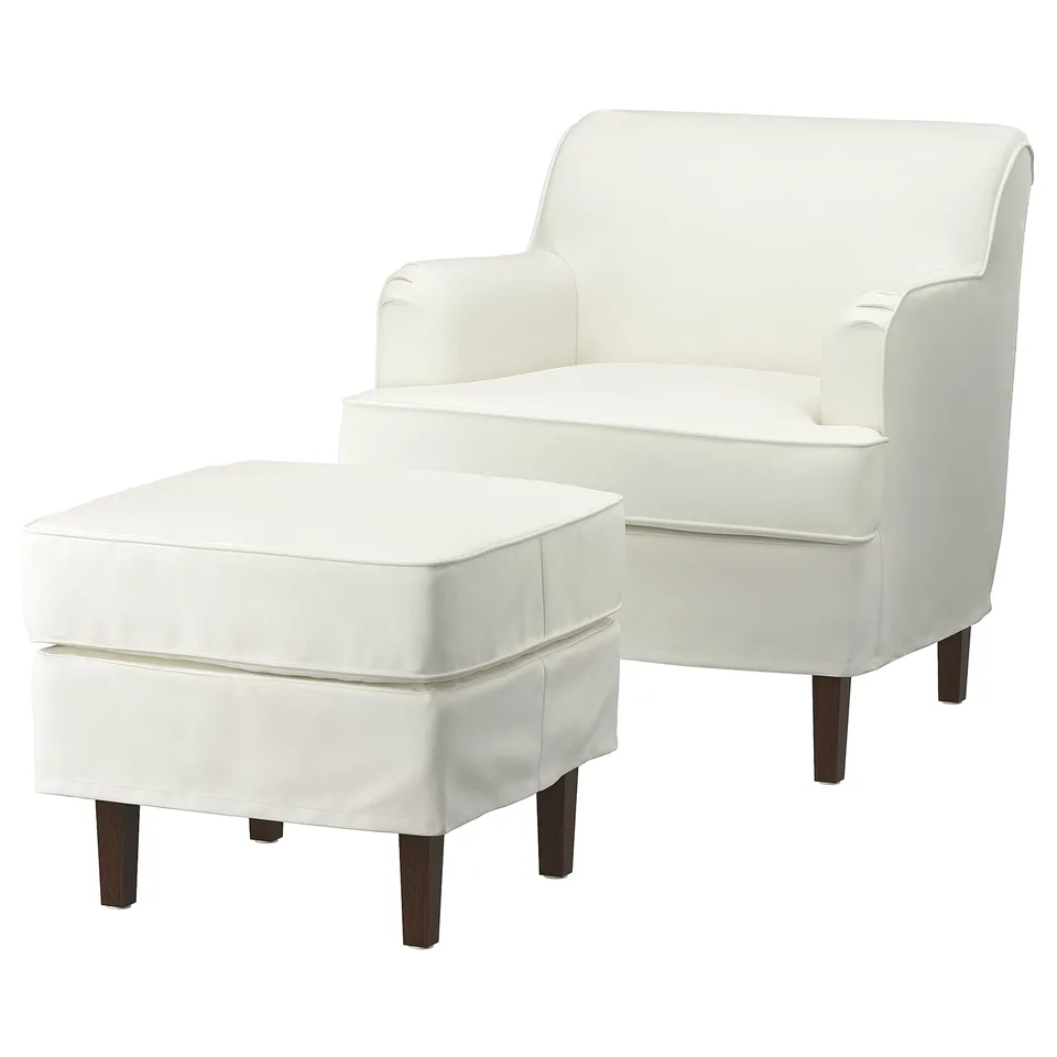 White cotton armchair & ottoman set, elegant traditional design, cushioned seat.