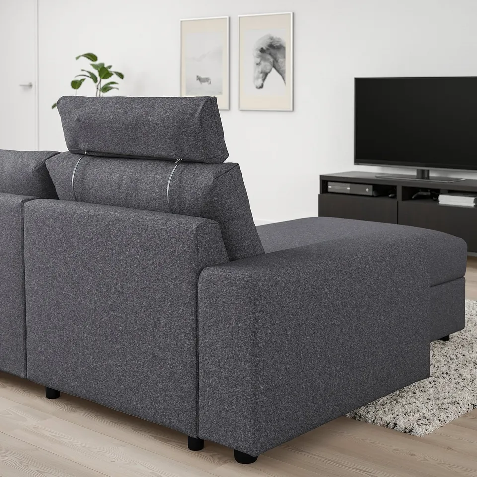 Grey VIMLE sofa with headrest in minimalist living room.