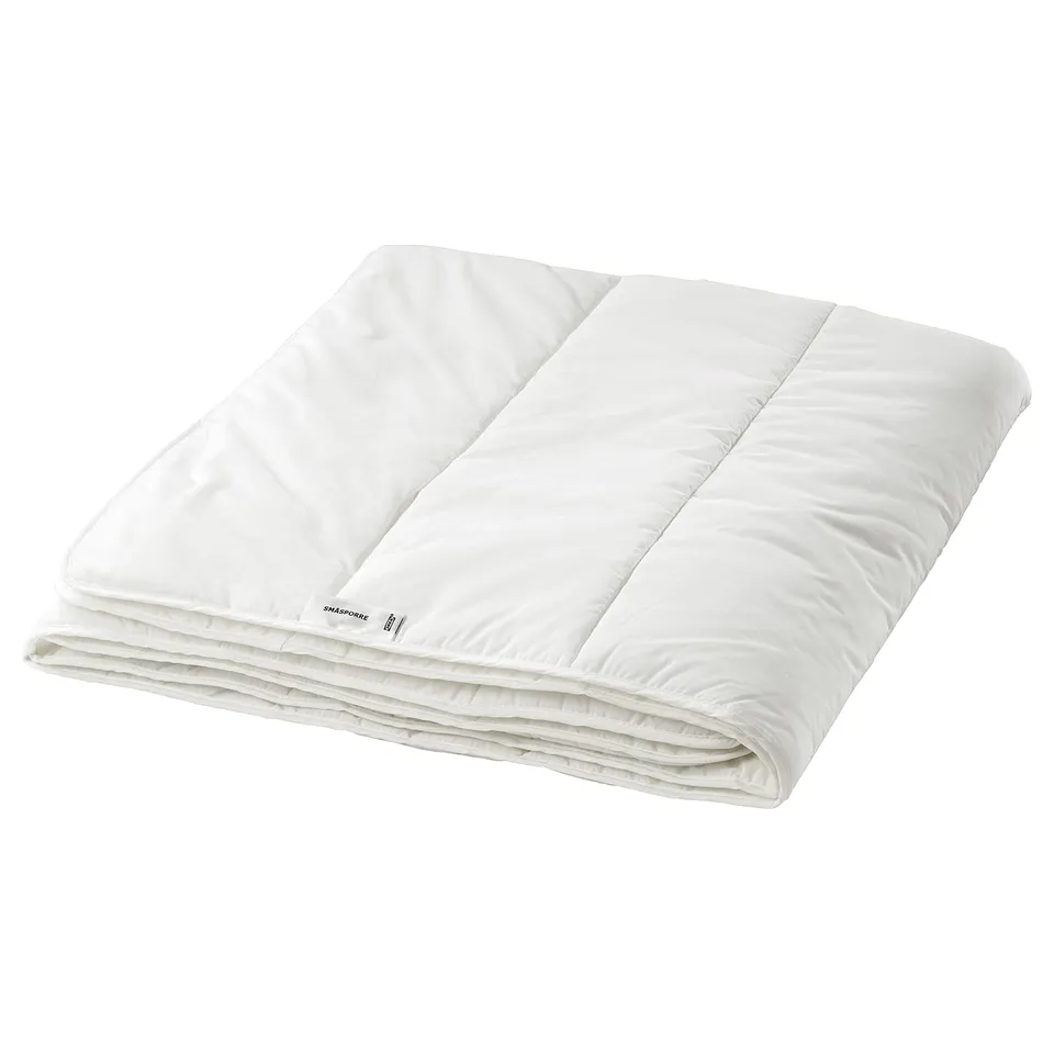 Folded white SMÅSPORRE blanket, smooth texture, rectangular shape, simple design.