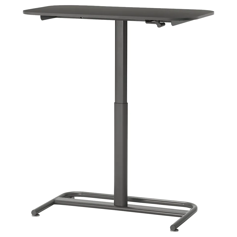 The SEGRARE sit/stand table adjusts from 75-125 cm, featuring a black metal frame and melamine tabletop, designed for home offices.