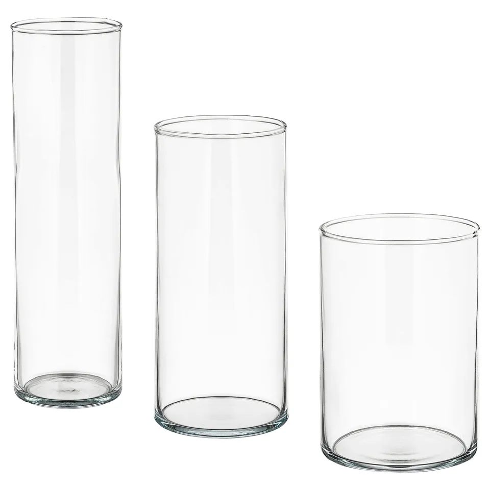 Three clear glass CYLINDERs, large to small, nested together. Simple, minimalist design, transparent. Ideal decorative or storage vessels.