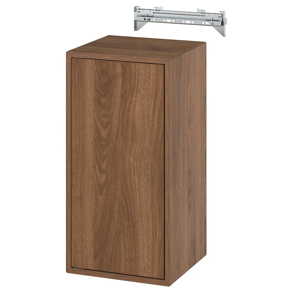 An EKET brown wooden cabinet with a single door and a metallic suspension rail.