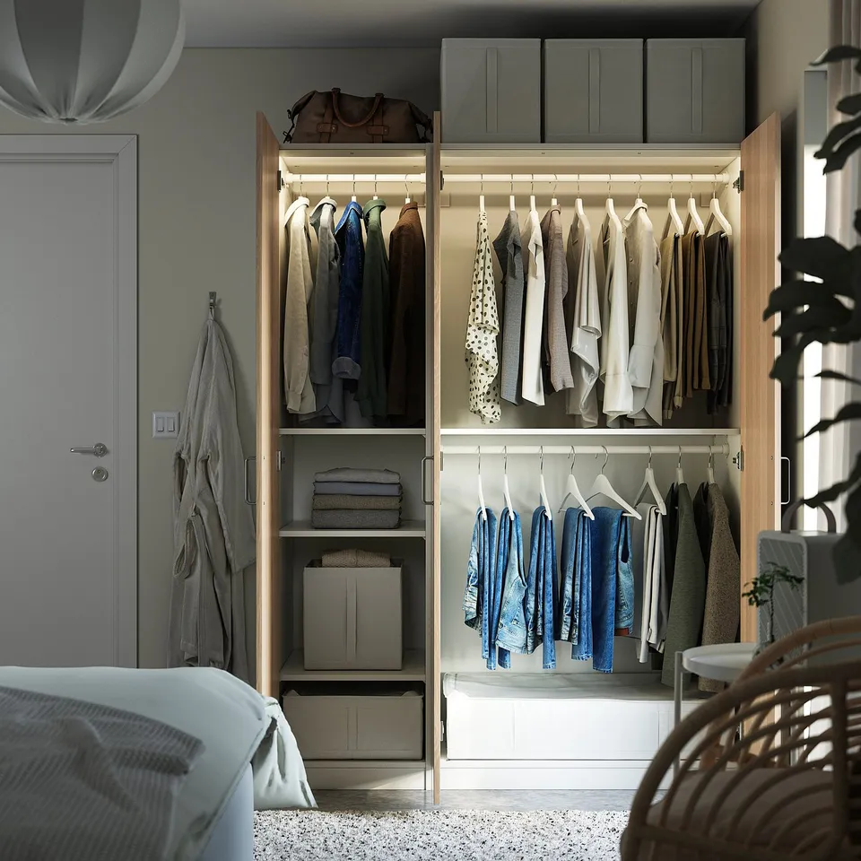 Open wardrobe with clothes & storage