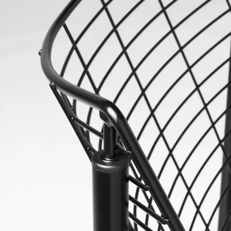 Close-up of SKÅLBODA chair frame, showing sturdy, well-crafted metal joints and mesh texture.