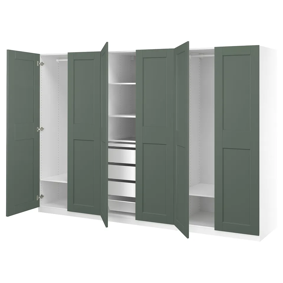Large wardrobe with green doors, multiple shelves, and compartments. Elegant design for organised storage.