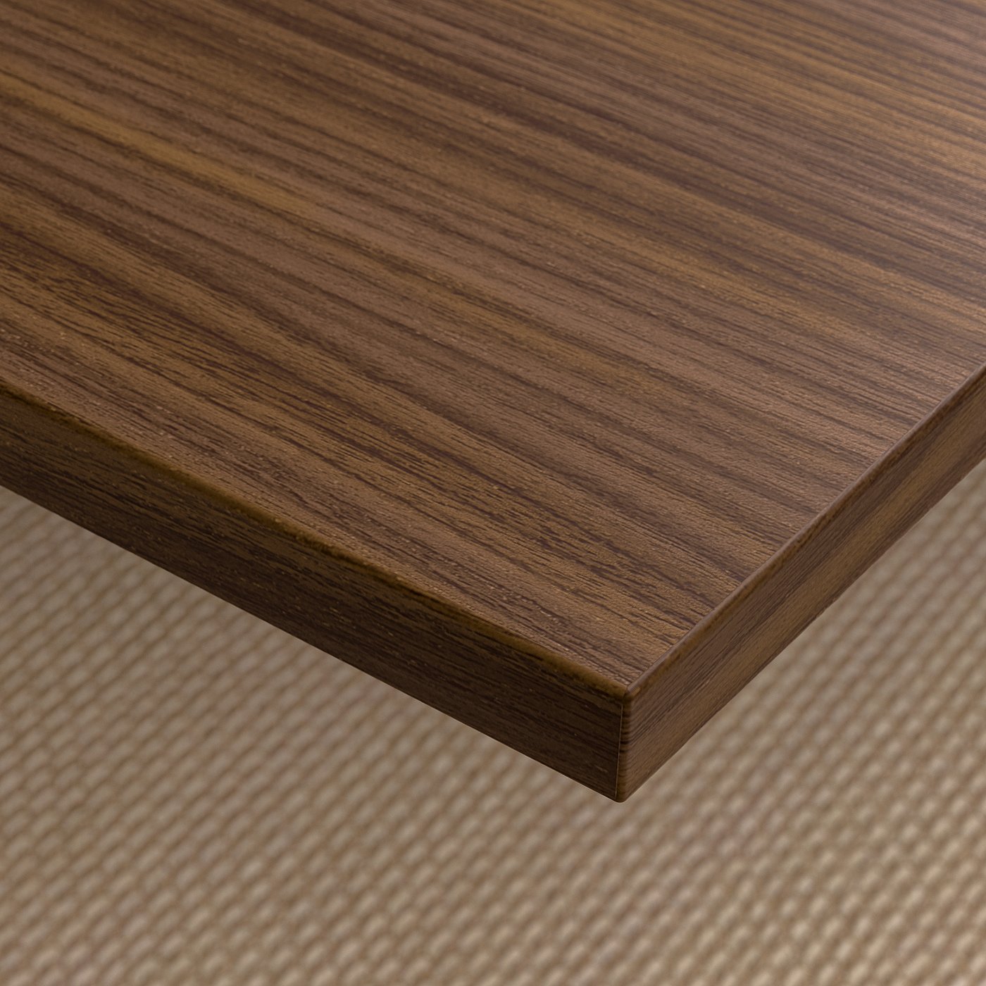 Close-up of a sleek, well-finished wooden tabletop with visible grain texture, resting on a patterned mat.