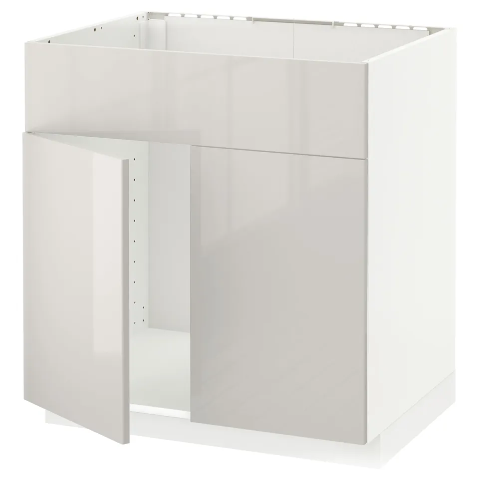A white METOD kitchen cabinet with a glossy finish. The cabinet is rectangular, designed for a modern kitchen, with clean lines and a minimalist look.