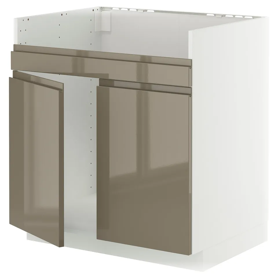 Depicts a white METOD kitchen cabinet with dark grey-brown high gloss doors. The cabinet modern snap-on hinges and a sleek, minimalist design.