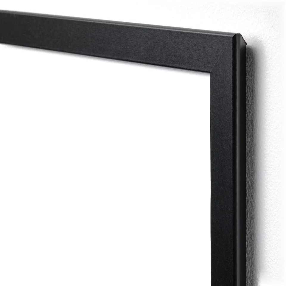 Black picture frame, sleek design, smooth edges, mounted on a plain wall.