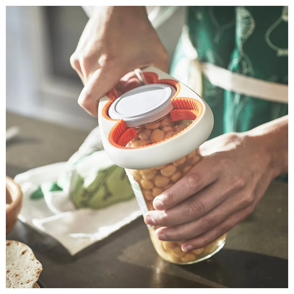 Using UPPFYLLD jar opener with packaged food in background.