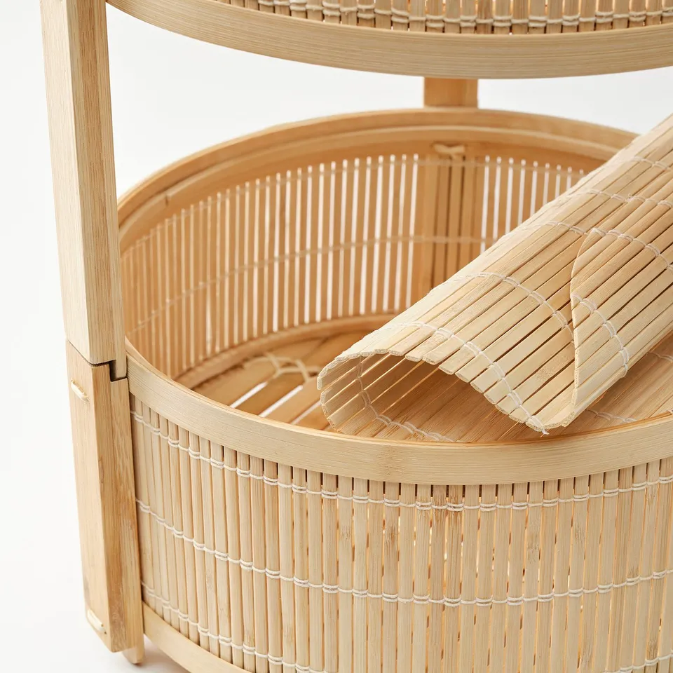 Round bamboo fruit basket with ventilated design; handcrafted, natural materials.