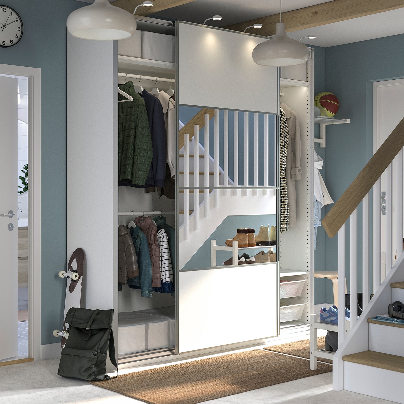 Depicts a modern, blue and white PAX wardrobe with mirrored sliding doors, housing clothes and accessories.