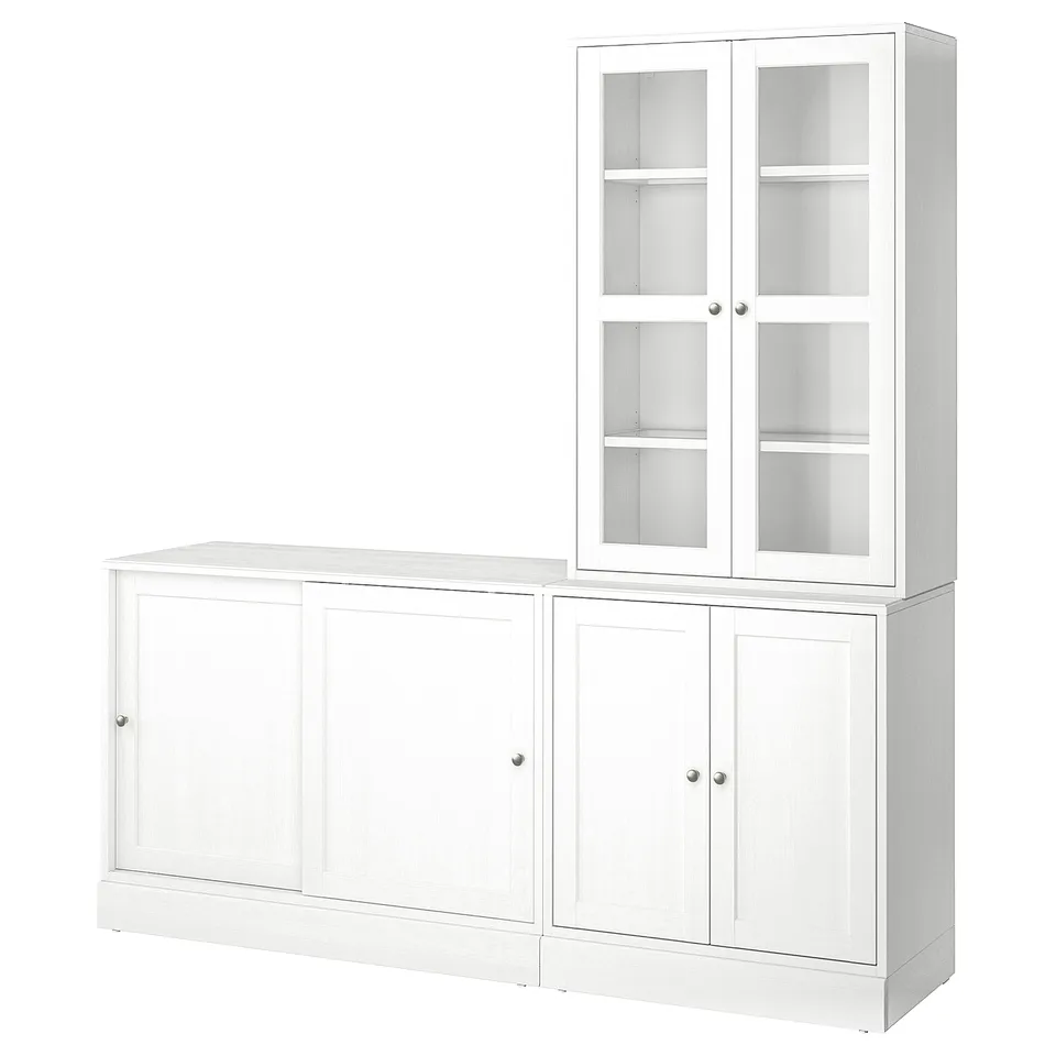 A white HAVSTA furniture set. It a sideboard and a glass-door cabinet in a rustic design with solid pine and clear lacquer.