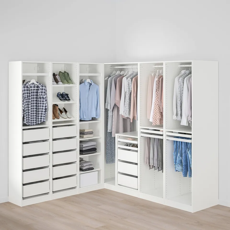 A well-organized closet with clothes hangers, shelves, and drawers, maximising corner space.