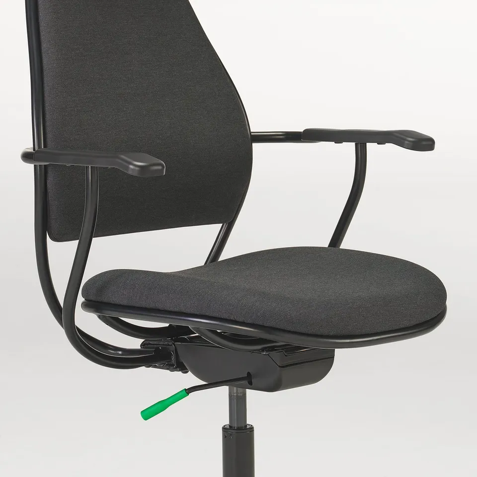 Black gaming chair with adjustable armrests, high back, and headrest cushion.