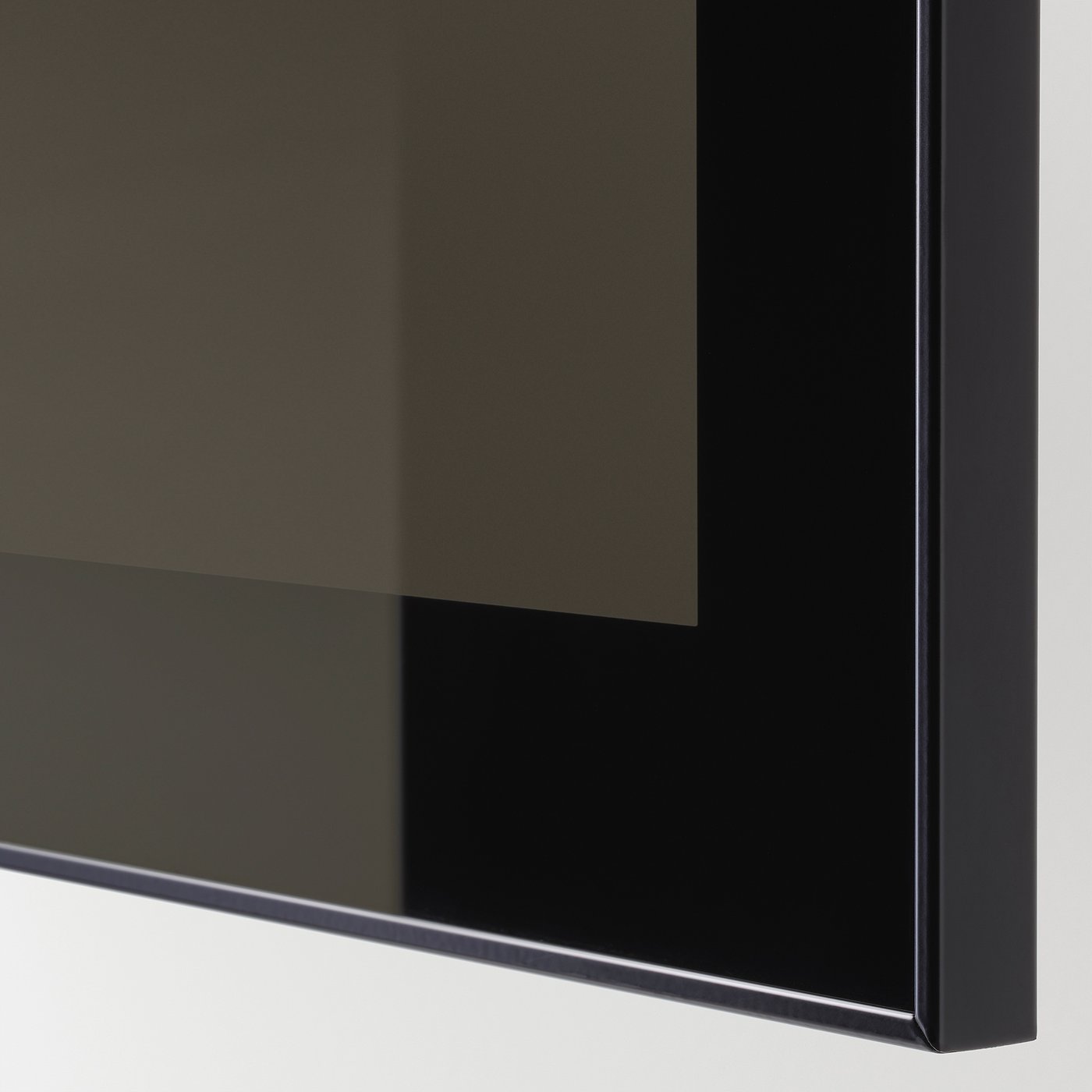 Close-up of sleek, modern black glass panel with polished edge, reflecting light subtly.