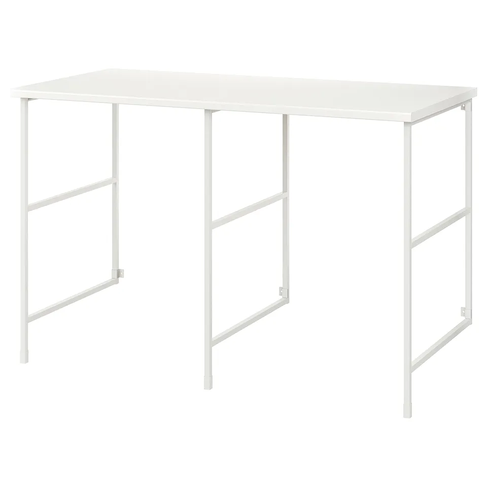 ENHET white desk. Metal legs, rectangular shape, minimalist design. Ideal for work spaces.
