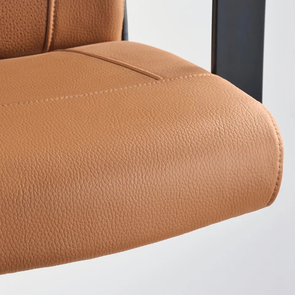 A close-up of a brown MILLBERGET swivel chair, showing its soft, textured fabric and neat stitching.