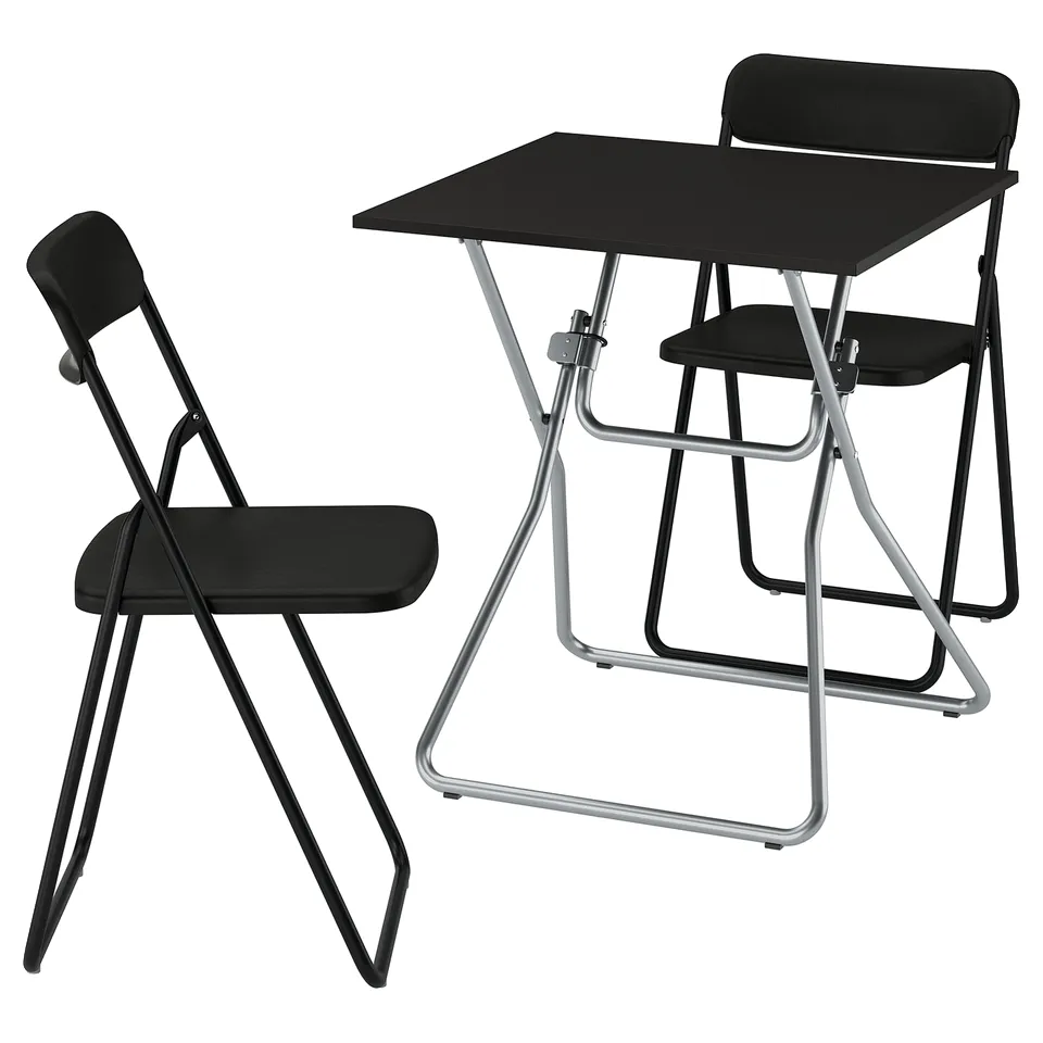 A black GUNDE foldable table and chair set made of steel and plastic, designed for easy storage.