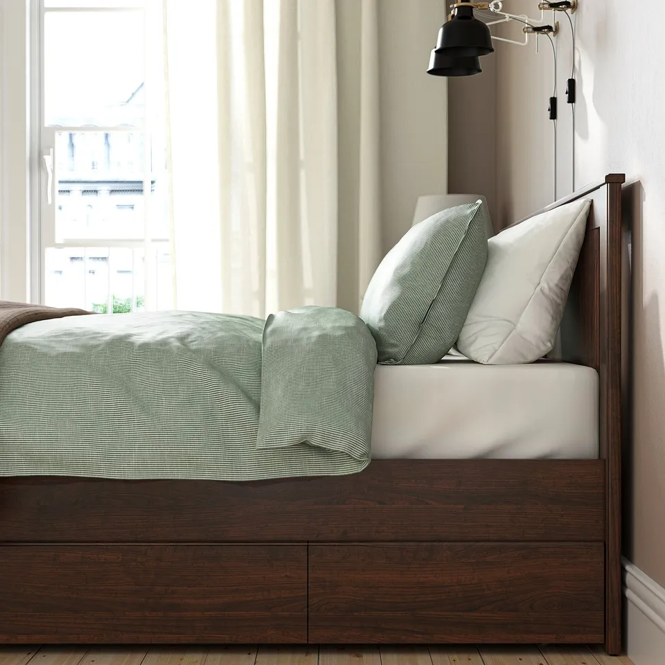 Neat bedroom setup with a sturdy, high-legged bed frame, soft edges, and under-bed storage.