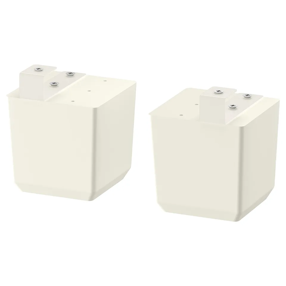 Two white FÖRBÄTTRA adjustable feet for cabinets, made of solid birch wood.