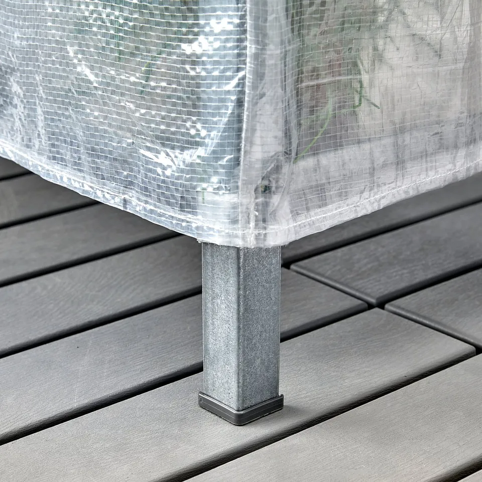 Plastic cover on metal legs. Part of HYLLIS shelving, protects items from dust and rain.