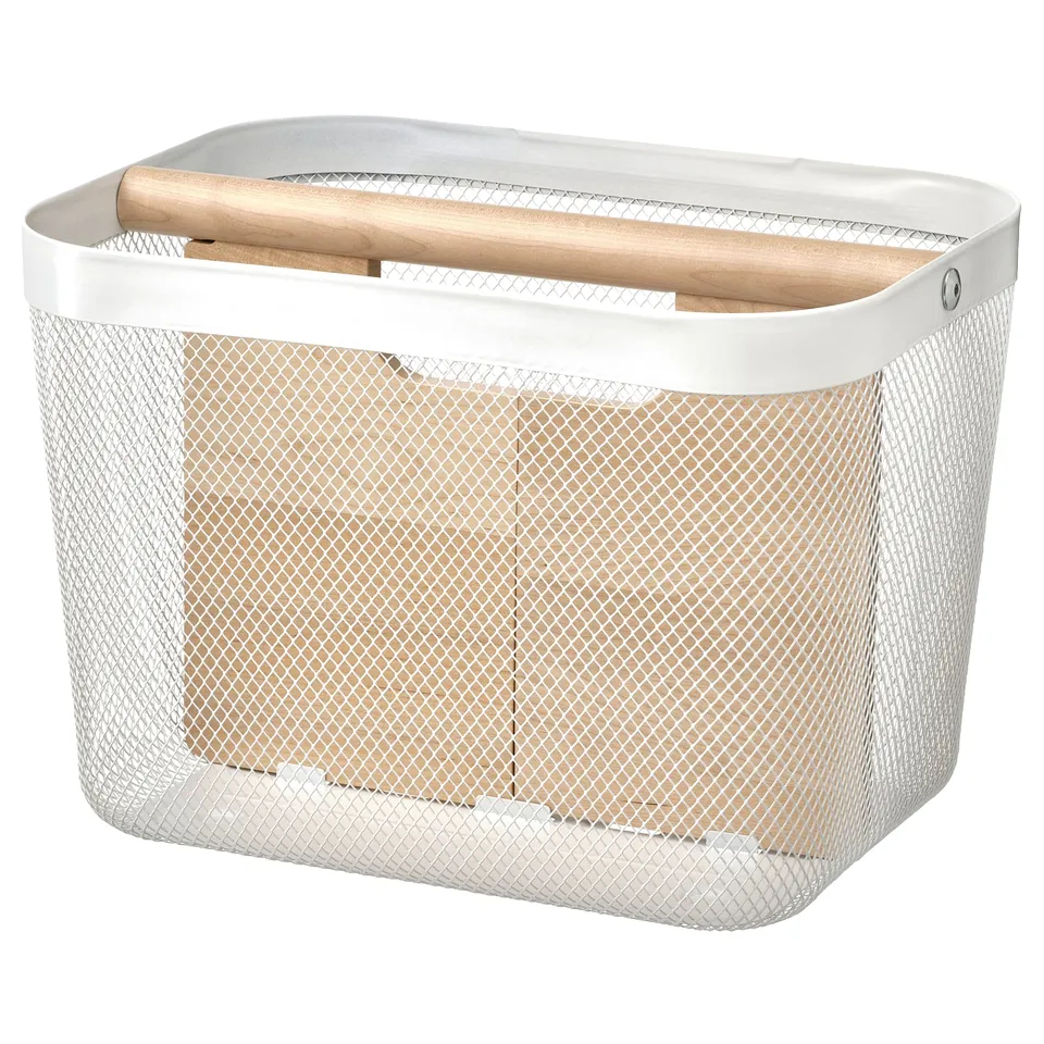 A white RISATORP storage basket with a mesh design, featuring a wooden handle and divider for organising items.