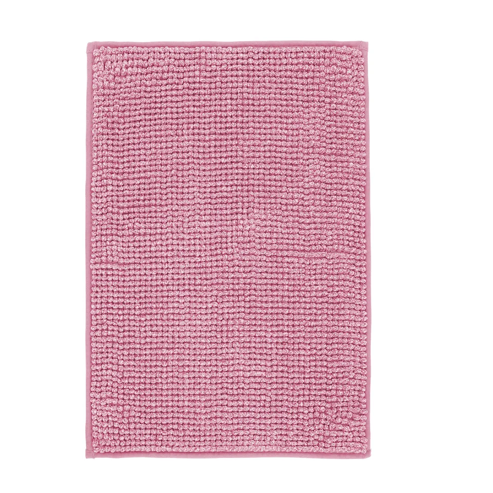 Pink rectangular bath mat with bumpy texture, ultra-soft microfiber material.