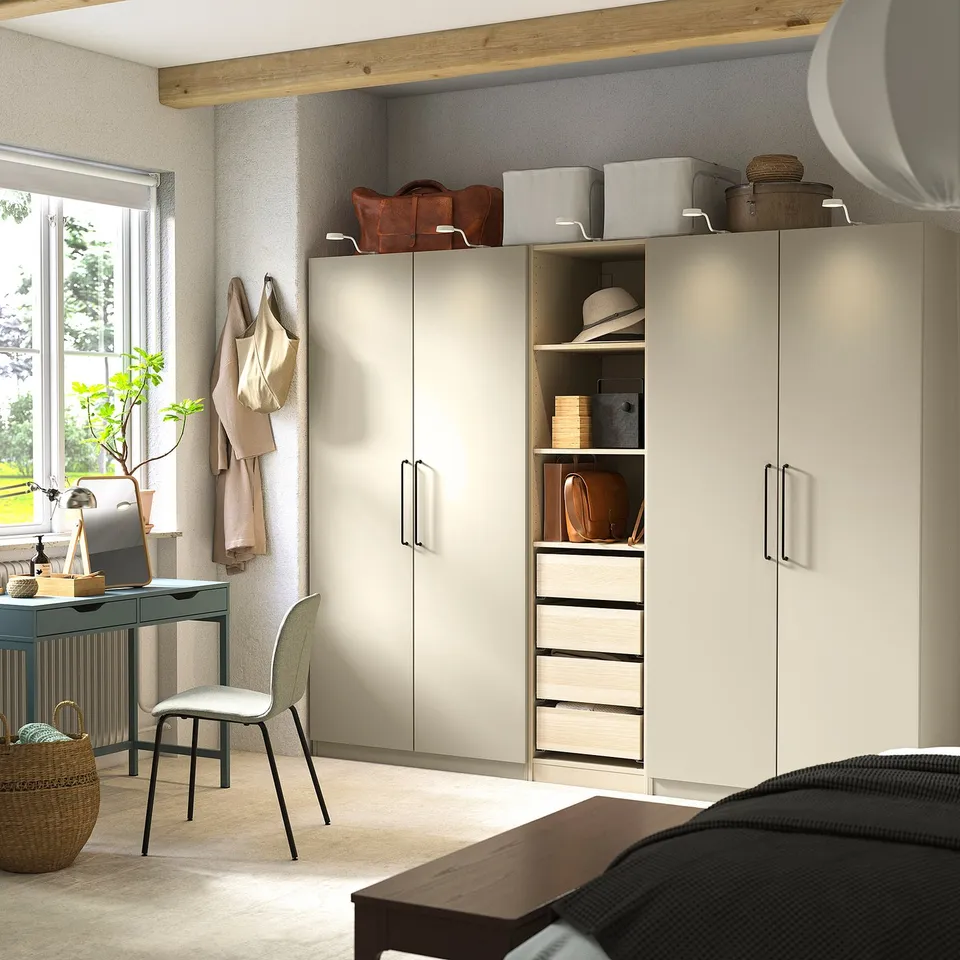 Beige PAX wardrobe with shelves, desk, chair, minimalist.