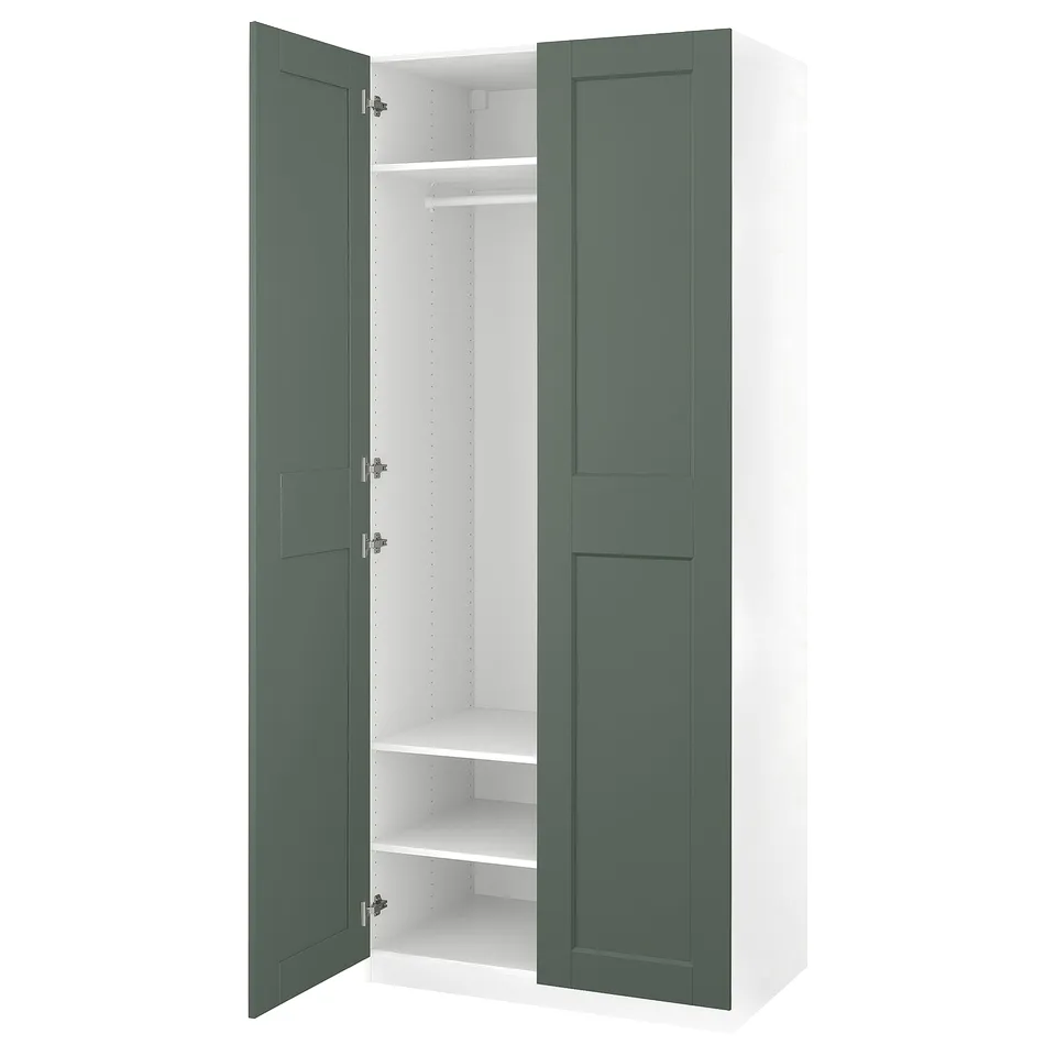 Displays an open green and white PAX wardrobe. The wardrobe has two doors, one shelf, and a clothes rod inside.