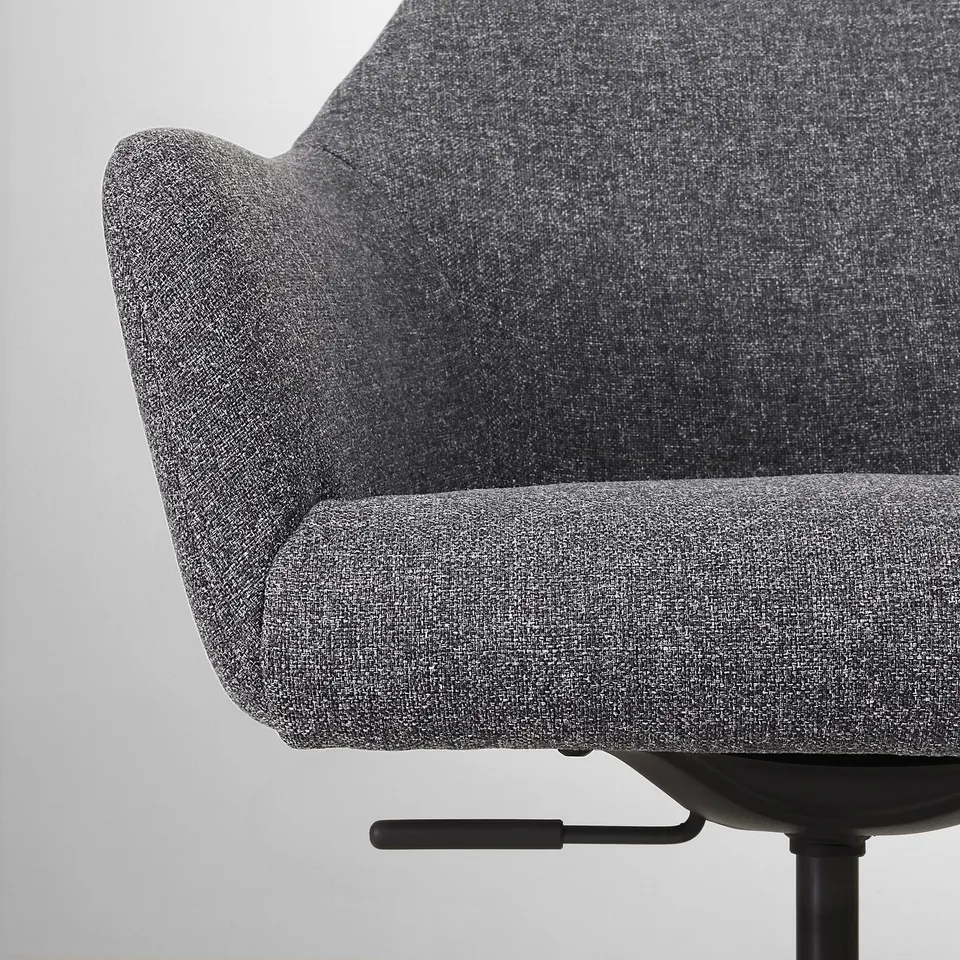 Close-up of a grey, cushioned swivel chairs seat and backrest. Soft, durable upholstery.