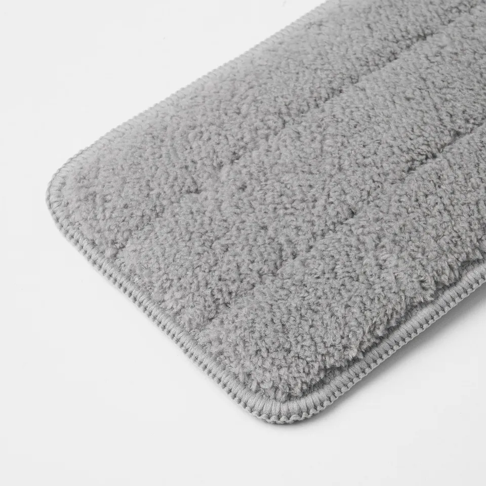 Close-up of absorbent, textured microfiber cloth, folded neatly, showcasing its soft, plush surface and durable edge stitching.
