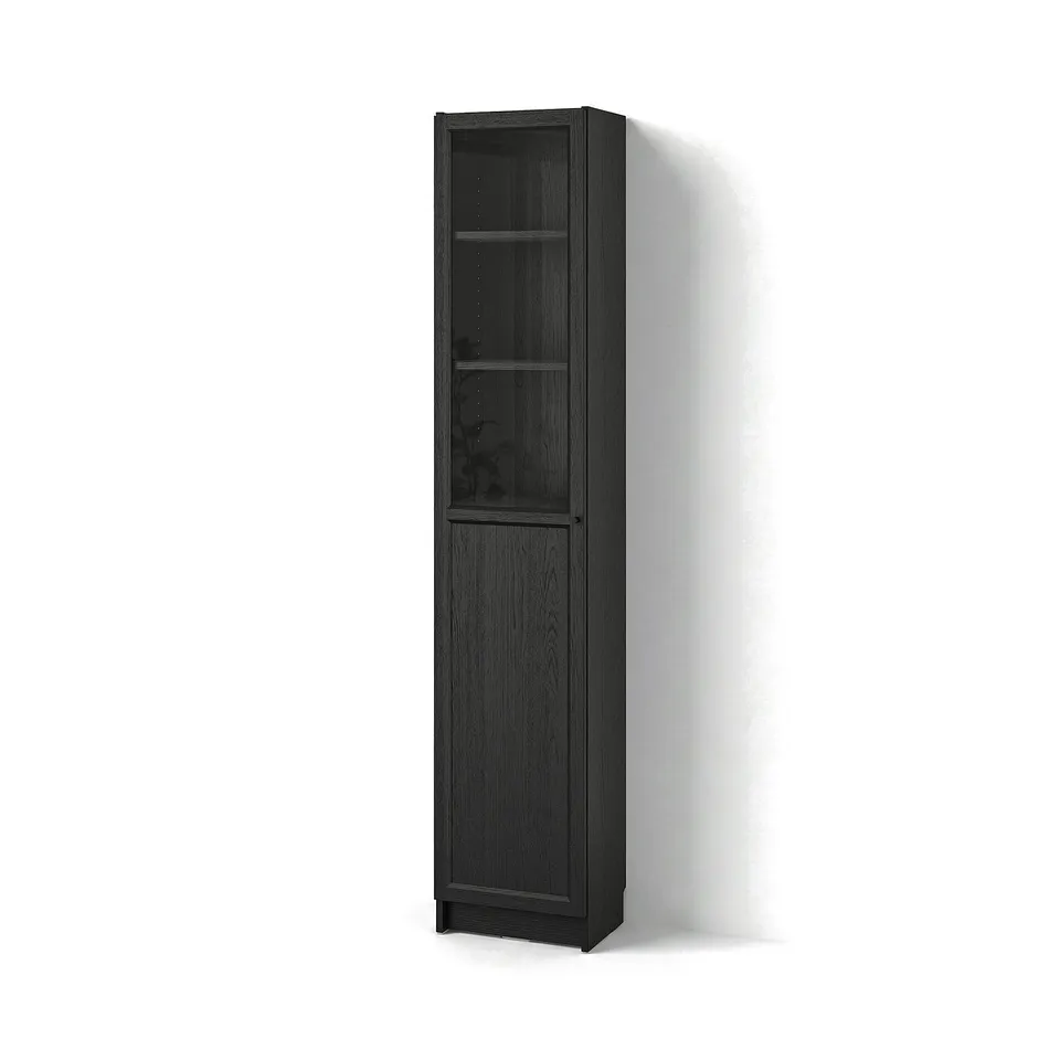 A tall, dark brown BILLY bookcase with a glass door and adjustable shelves.
