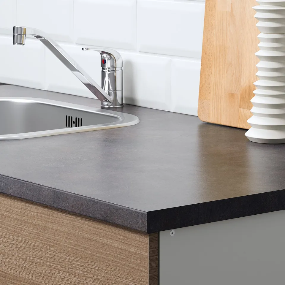 Kitchen counter with sink and tap. Modular design allows customization. Spacious and functional.