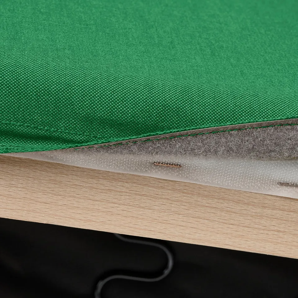 Green KLIPPAN sofa cover with durable fabric and hooks.