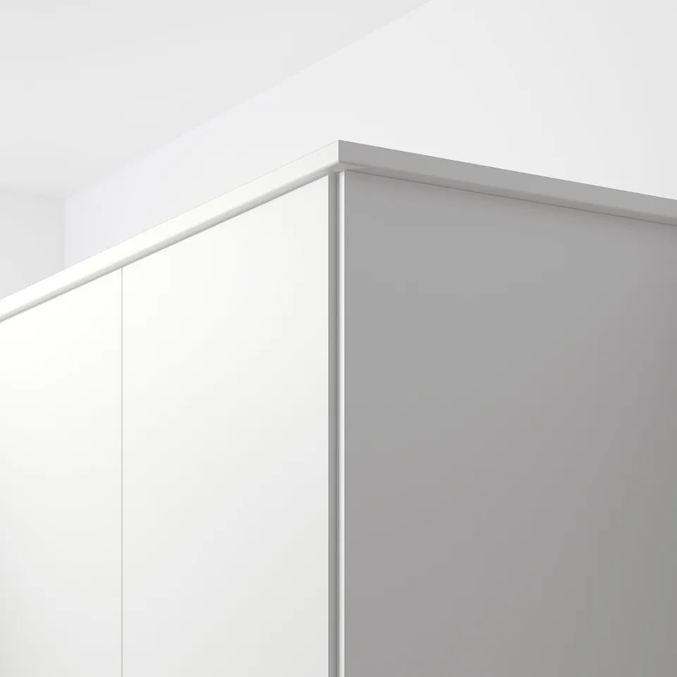 White FÖRBÄTTRA moulding hides cords and sockets on wall.