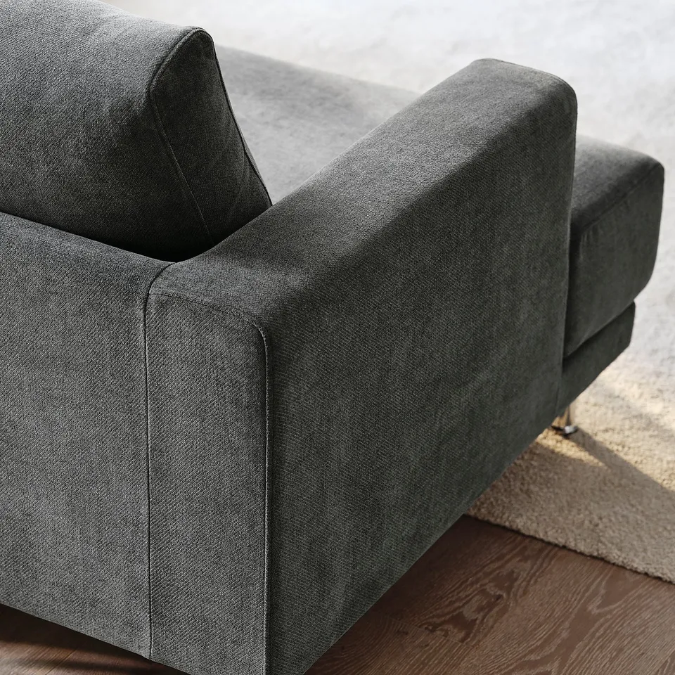 Modern grey sofa showcasing plush cushions and sleek design, emphasising high-quality comfort and contemporary style.