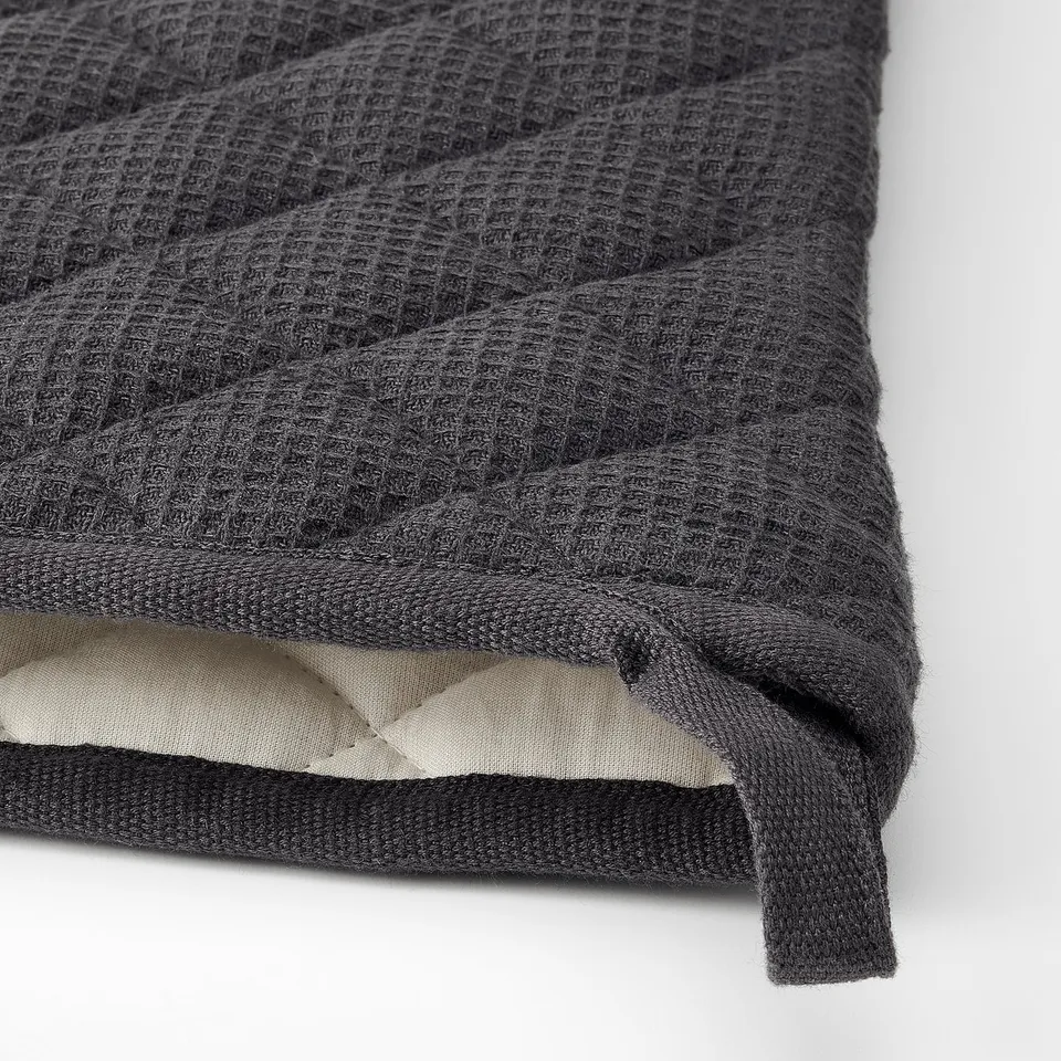 Dark grey thick towel with textured weave and soft inner layer, folded neatly.