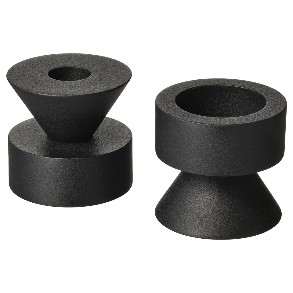 Two black, modern, stackable metal candlesticks. One side for tealights, the other for tall candles.
