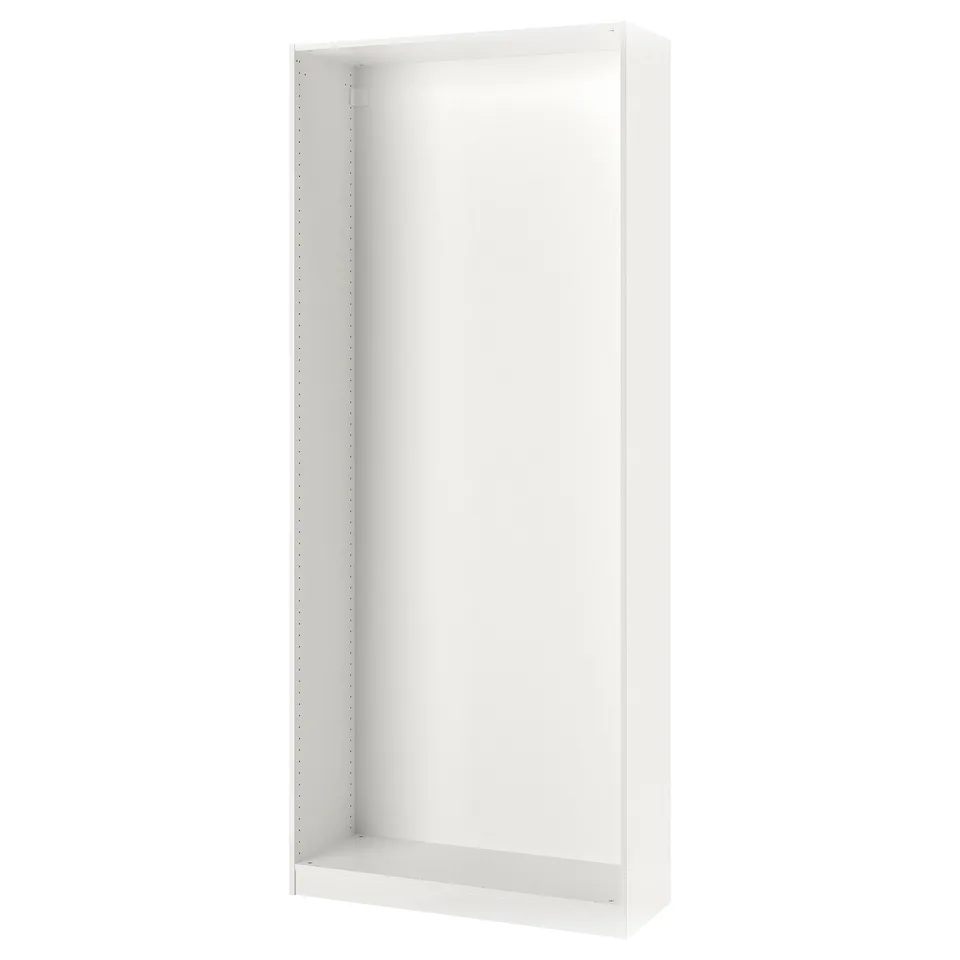 A white PAX wardrobe frame. Its rectangular, minimalist, and made of particleboard and laminate. Perfect for organising clothes in limited spaces.