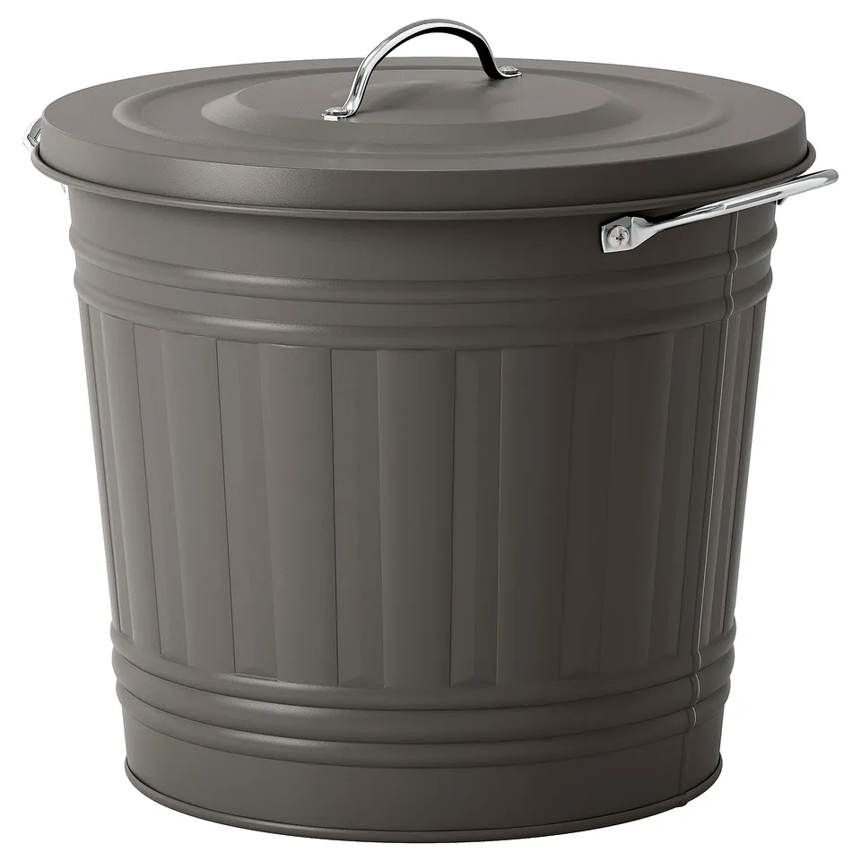 The KNODD grey metal rubbish bin a lid with a handle and under-lid hook. Its sturdy, cylindrical shape is designed for easy waste management.