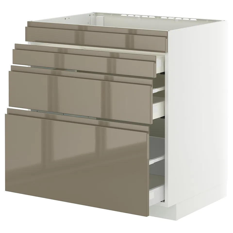 Depicts a METOD kitchen cabinet with four voxtorp high-gloss dark grey-brown drawers, each equipped with integrated handles, set against a white unit.