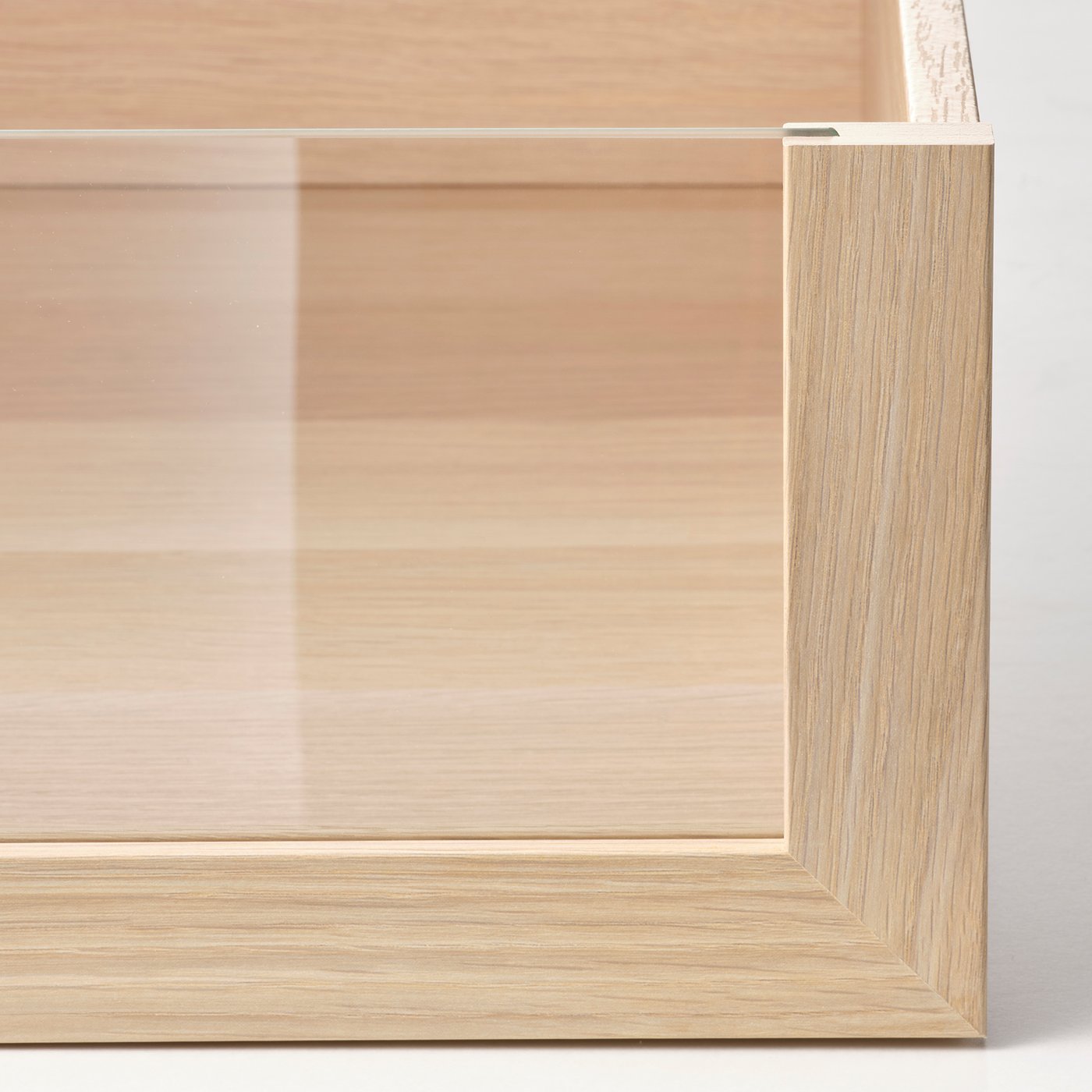 Close-up of wooden drawer edge, smooth finish and modern design.
